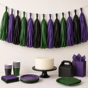 Hulk party tissue paper tassel garland above a dessert table
