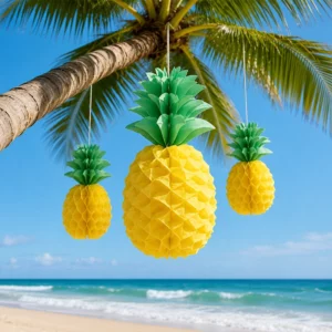 Yellow and green pineapple honeycomb decorations hanging at a tropical beach