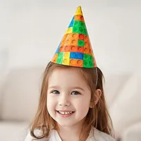 Child wearing a colourful patterned cone party hat