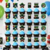 Gaming party cupcake toppers with controllers and arcade graphics