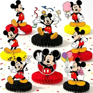 Eight Mickey Mouse honeycomb table centrepieces on a party table