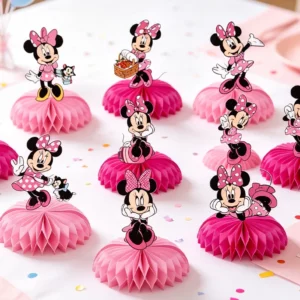 Minnie Mouse pink honeycomb centrepieces on a birthday party table