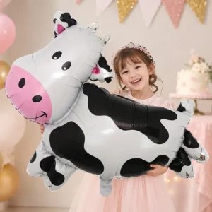 Large black and white cow-shaped foil balloon with a pink face