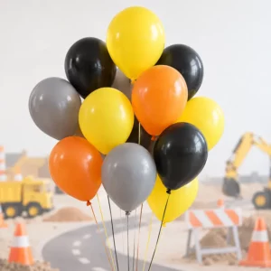 Yellow, orange, black and grey latex balloons at a construction party