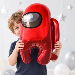 Boy holding a red Among Us character foil balloon