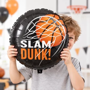 Boy holding a black and orange basketball foil balloon with Slam Dunk print