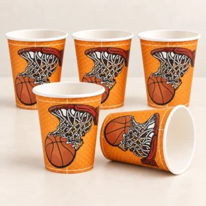 Five orange basketball hoop paper cups on a pale tabletop, with one cup on its side