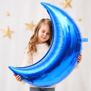 Girl holding Giant Blue Moon Foil Balloon 90cm against a pale background