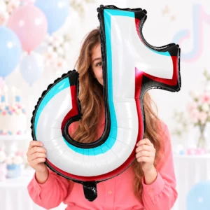 Girl in a coral blouse holding a silver music note foil balloon with cyan, red and black edges