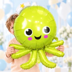 Boy holding Octopus Ocean Party Foil Balloon 64x89cm against a pale background