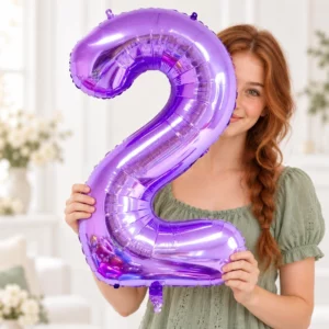 Girl holding Purple Foil Number 2 Balloon 100cm against a pale background
