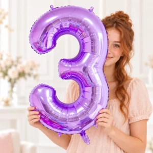 Girl holding Purple Foil Number 3 Balloon 100cm against a pale background