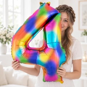 Girl holding Rainbow Foil Number 4 Balloon 100cm against a pale background