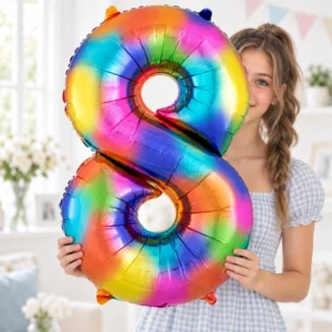 Girl holding Rainbow Foil Number 8 Balloon 100cm against a pale background