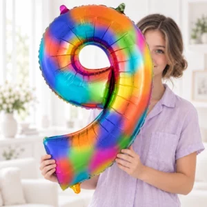 Girl holding Rainbow Foil Number 9 Balloon 100cm against a pale background